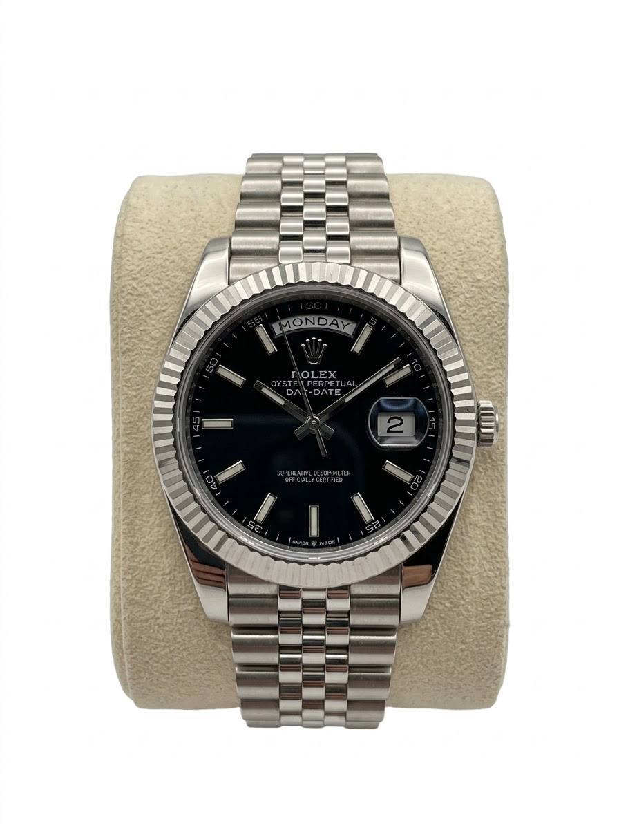 ROLEX DAYJUST IN OYSERSTEEL WITH A BLACK DIAL