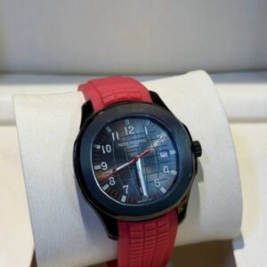 PATEK PHILIPPE AQUANAUT BLACK DLC/PVD PAIRED WITH A RED STRAP