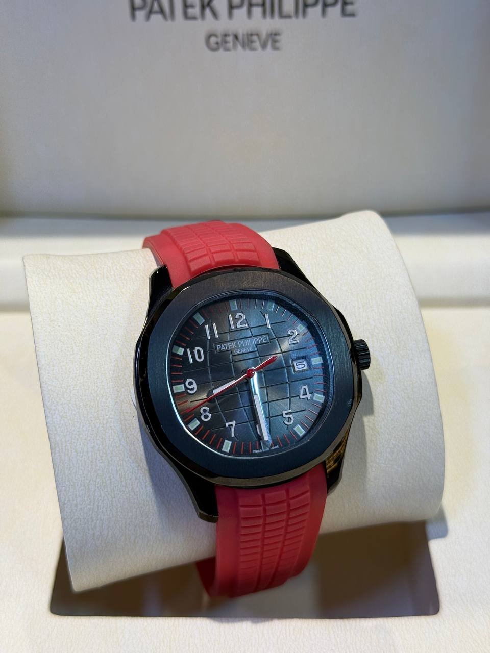 PATEK PHILIPPE AQUANAUT BLACK DLC/PVD PAIRED WITH A RED STRAP
