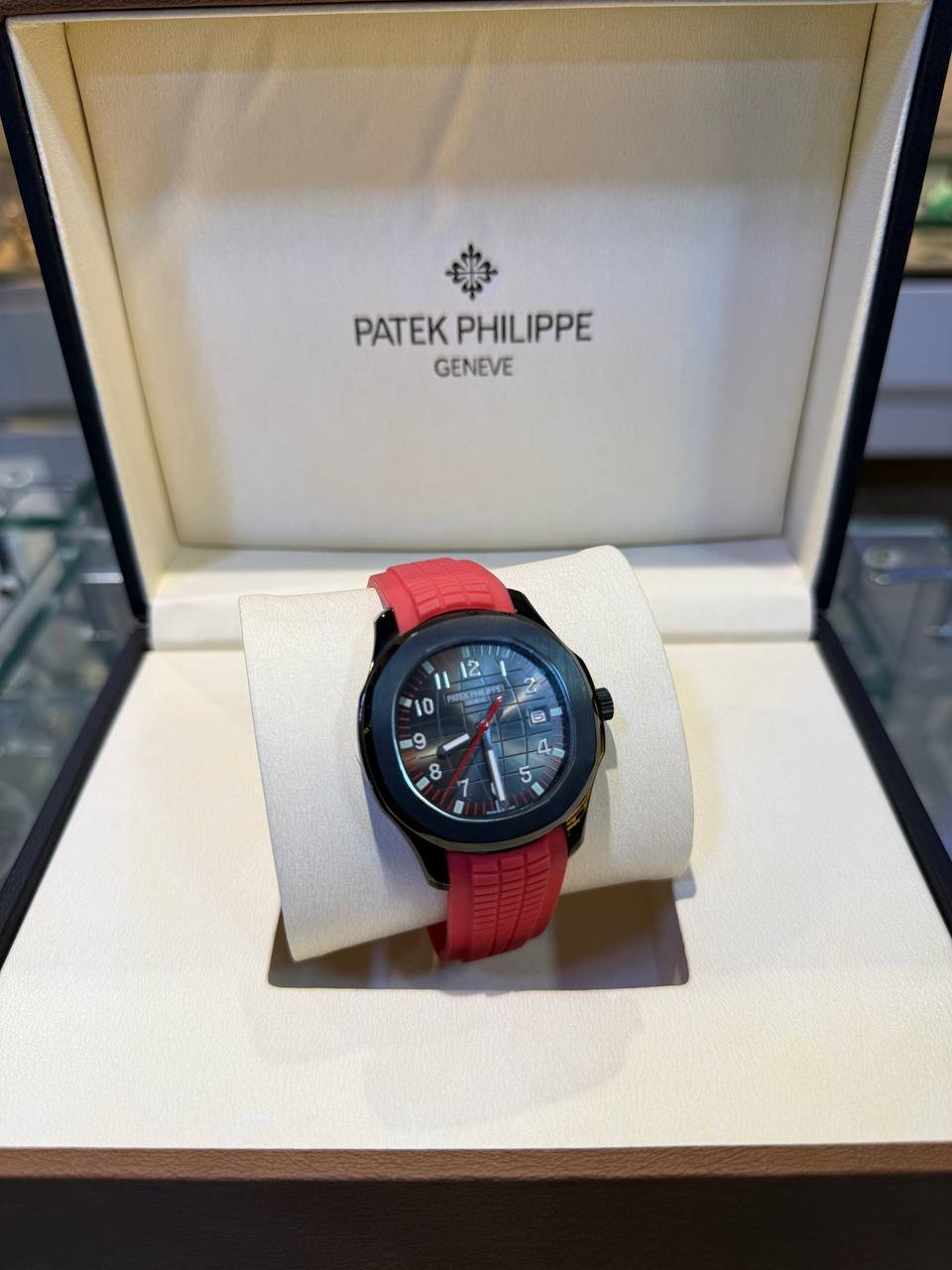 PATEK PHILIPPE AQUANAUT BLACK DLC/PVD PAIRED WITH A RED STRAP - Image 2